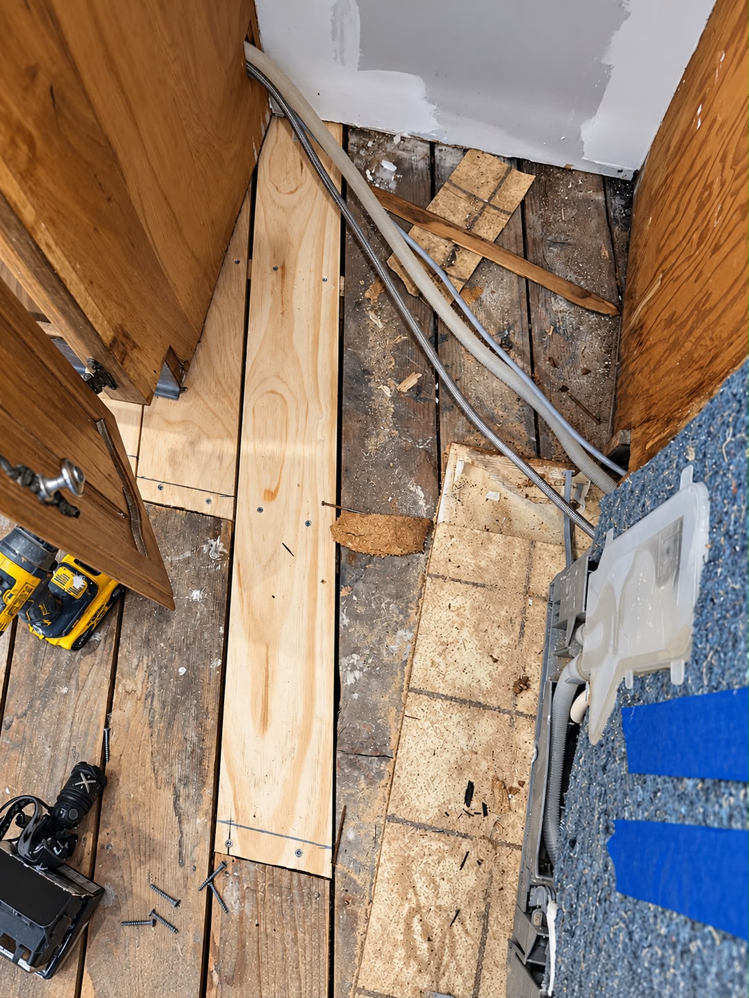 Replacement wood fitted alongside the kitchen cabinets
