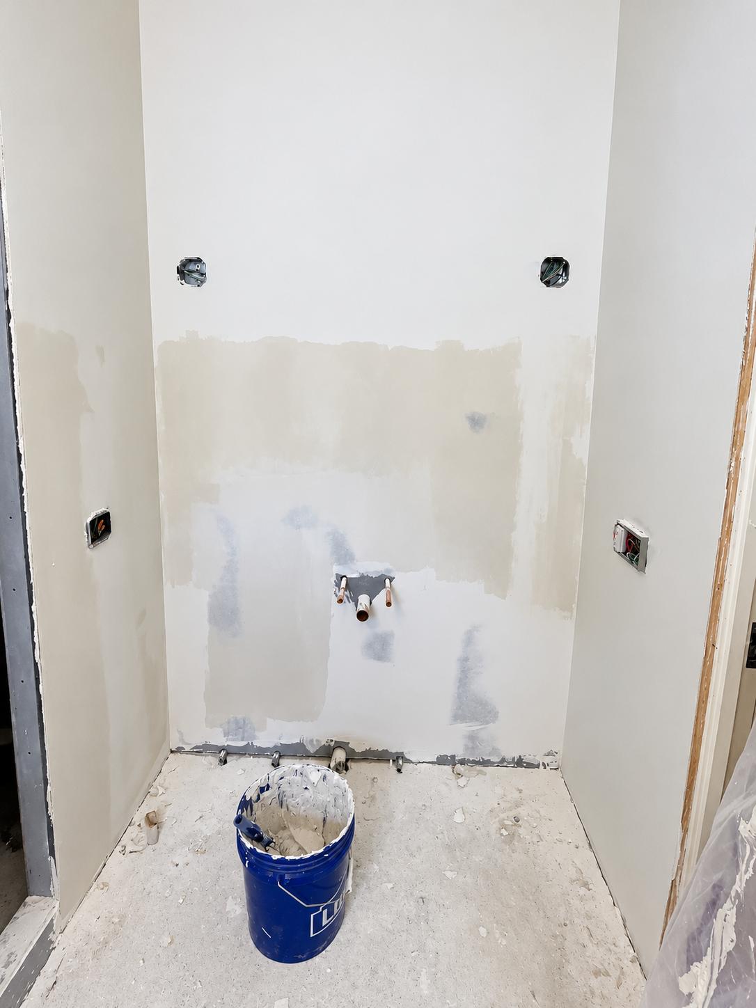 After: Drywall finished around plumbing