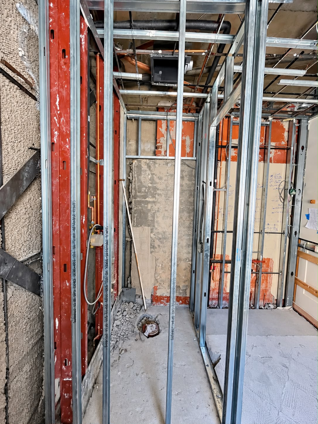 Before: Open framing and plumbing rough-in