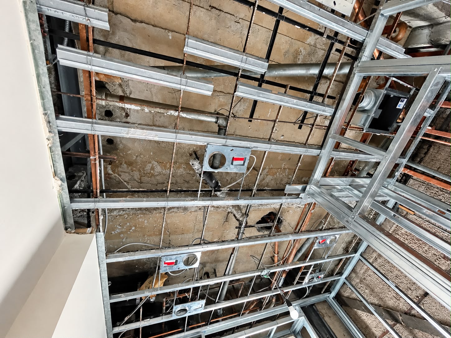Before: Exposed ceiling framing