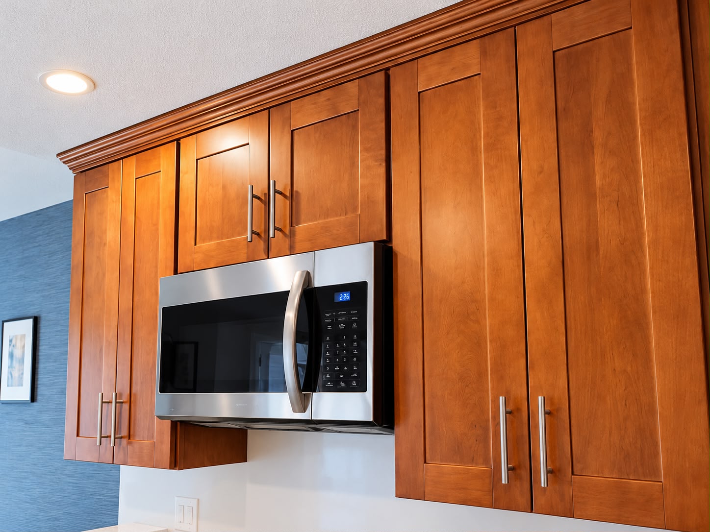 Before: original brown wooden upper cabinets