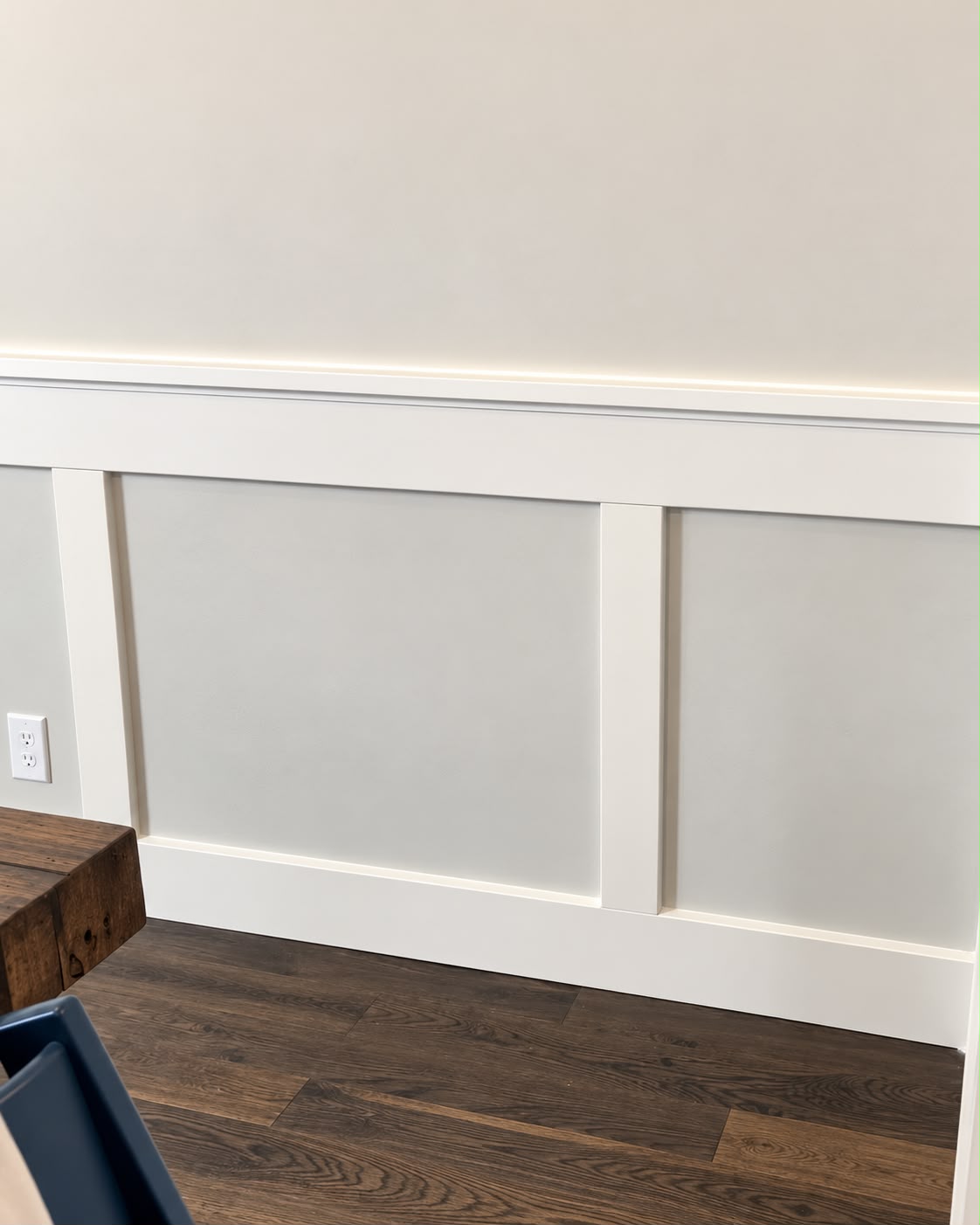 White wall panel molding with clean vertical trim and baseboards